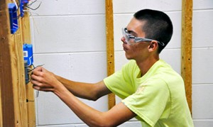 student working on wiring