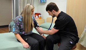 student taking blood pressure