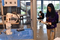 Student working with robot