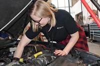 Student working on car