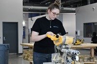 Student using construction equipment